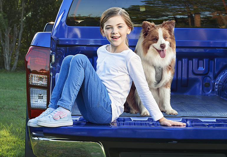 headshot of Brook Wayman sitting on a D-MAX
