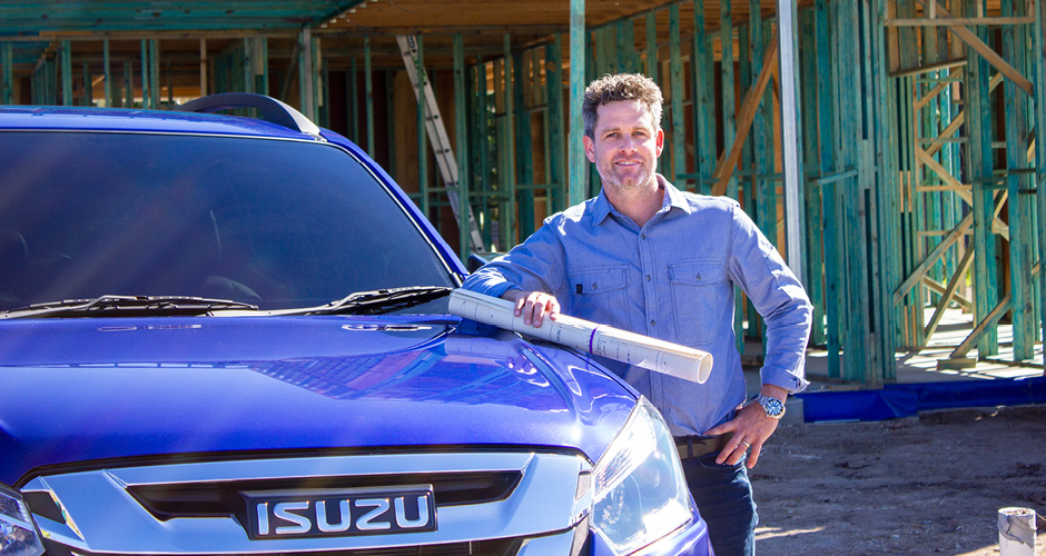 Headshot of Dave Wayman standing next to his Isuzu vehicle