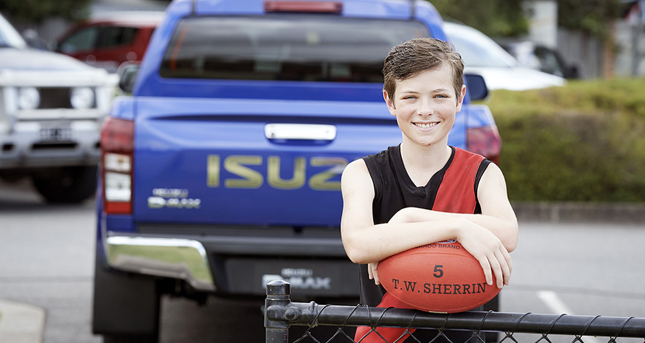 Zac Wayman standing in front of an Isuzu D-MAX