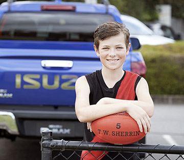 Zac Wayman standing in front of an Isuzu D-MAX