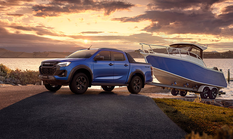 A D-MAX towing a trailer through the water