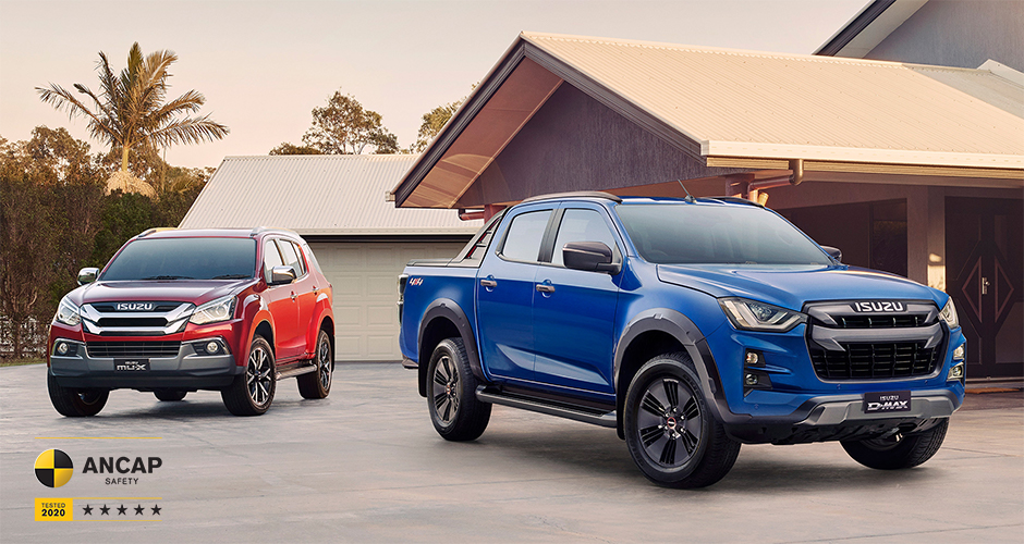 A cobalt blue D-MAX driving through the sand